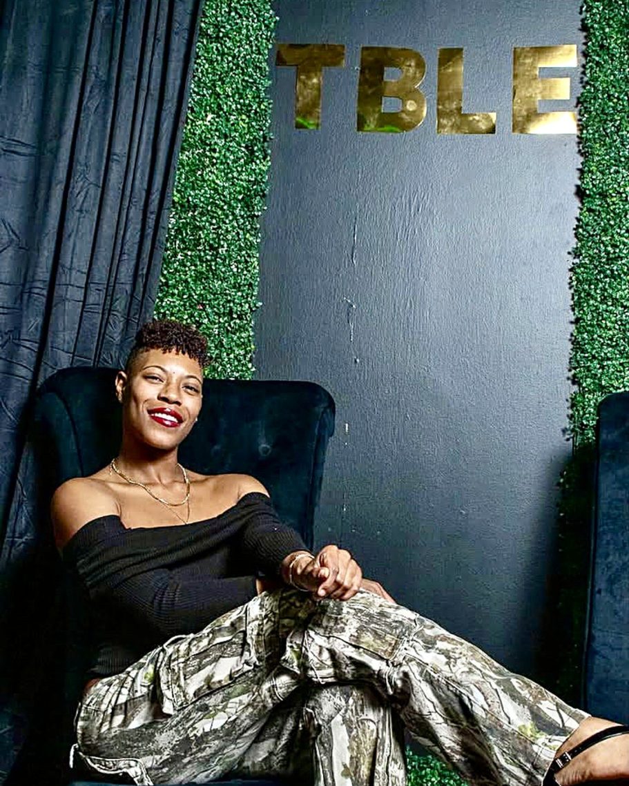 Tabria SIms, Founder of SoChauntay Dance LLC Tabria Chauntay Monique Sims, founder of SoChauntay Dance LLC, seated and smiling in a portrait